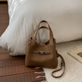 Chic dark brown lychee leather bucket bag with silver twist lock and crossbody strap - No Pendant / Brown