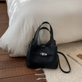 Minimalist black pebble leather bucket bag with silver buckle and crossbody strap - No Pendant / Black