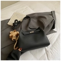Chic black litchi pattern bucket bag with silver lock and plush puppy charm - Black With Pendant