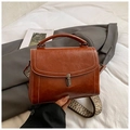 Vintage caramel faux leather handbag with wide jacquard strap and metallic clasp closure - Brown