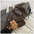 Chic dark brown vintage handbag with contrast stitching and cute plush dog charm - With Charm / Brown