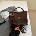 Vintage dark brown faux leather backpack with gold clasp for casual or school use - Coffee