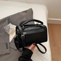 Elegant black Boston style handbag in textured faux leather with gold hardware accents - Black