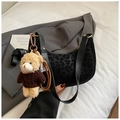 Detail of crescent shoulder bag with leopard flocking and plush bear charm - With Charm / Black
