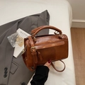 Chic retro brown pillow handbag in glossy PU leather with adjustable crossbody strap - Brown