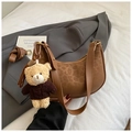 Detailed view of brown leopard print crescent hobo bag with a cute plush bear pendant - With Charm / Brown