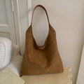 Macro shot of retro large capacity shoulder bag in brown faux suede with matte texture - Brown
