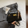 Glossy black leather crossbody bag with golden clasp and colorful bead tassel accent - Black with Pendant