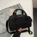 Minimalist black fabric crossbody tote bag with dual handles and adjustable strap - Black