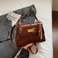 Dark brown vintage style glossy leather shoulder bag with golden clasp and beaded charm - Brown with Pendant