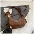 Detail of leopard print hobo bag with gold hardware on a gray blazer background - No Pendant / Brown