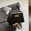 Elegant black glossy leather crossbody bag with gold hardware and top handle detail - Black without Pendant