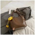 Dark brown minimalist bucket bag in glossy PU leather with yellow sunflower charm - With Pendant / Brown with Pendant