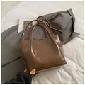 Minimalist dark brown polished leather bucket bag with dual handles and slim shoulder strap - Brown No Pendant