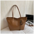 Minimalist large brown faux leather tote bag with elegant flower charm on white desk - With Charm Style / Brown with Pendant