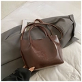 Minimalist brown oil-wax leather bucket bag with dual handles and adjustable shoulder strap - Coffee without Pendant
