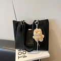 Minimalist black leather tote bag for women with golden hardware and cute brown bear charm - With Charm / Black