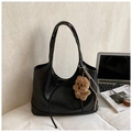 Chic black leather tote bag with a decorative bow and a cute plush bear charm for daily use - With Charm / Black
