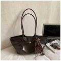 Deep brown oversized tote bag with silver buckle and leopard bear charm for commuting - Brown