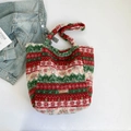 Furry tote bag featuring festive red, green, and white Christmas stripes with leather label - Red