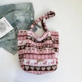 Winter plush tote bag with pink and brown stripes featuring a leather logo patch - Pink