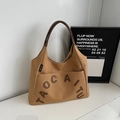 Minimalist tan canvas tote bag with letter applique and brown leather handles - Caramel color