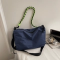Donkerblauwe geblokte crossbodytas met neongroene handgreep en zwarte brede riem - Blauw