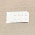 Dettaglio dell'estensione del reggiseno bianco senza cuciture con ganci in metallo - Taglia unica / Nudo Chiaro (2 Righe)