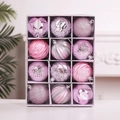 Detail of 12pcs pink Christmas ornaments with glitter, threaded and scaled textures in a box - Pink