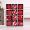 Detailed close-up of 12 red Christmas ornaments with diverse textures in a display box - Red