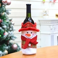 Detail of a festive snowman wine bottle cover with a red hat and scarf on a table - Snowman Wine Bottle Bag