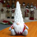 Macro detail of red knitted Christmas gnome decoration with a long white plush hat - White Hat (201925)