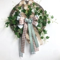Easter bunny wreath with rustic wooden wheel, assorted ribbons, and ivy greenery, 40cm size - Bunny Wheel Style