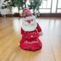 Detail of Santa plush toy with Merry Christmas embroidery and festive golden bell - Style 4 Santa Claus
