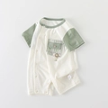 Katoenen babyromper met korte mouwen, groene ruitzak en smiley-gezicht detail - 66CM / Groen