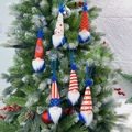 Set of 6 patriotic American gnome ornaments with stars and stripes on a decorated tree - Blue String Style
