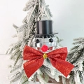 Disco ball snowman ornament with red glitter bow hanging on snowy Christmas tree branch - Snowman Red Bow 4cm Ball