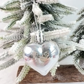 Polished silver heart-shaped Christmas ornament hanging on a snowy pine branch - Silver Ball Glossy