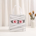 Detailed view of white Halloween mummy non-woven gift bag with scary red eye prints - White Mummy