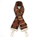Close-up of ethnic style woven bag strap with geometric pattern and golden metal clips - Silver Clasp / Brown