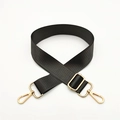 Detail of adjustable black woven nylon bag strap with polished gold lobster clasps - Dark Gray