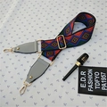 Detail of colorful geometric woven bag strap with adjustable gold buckles and leather ends - Style 3 Gray