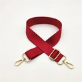 Detail of red nylon shoulder strap with golden metal swivel lobster clasps and buckle - Burgundy