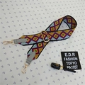 Close-up of bohemian geometric wide strap with golden metal buckles and faux leather ends - Style 2 Gray