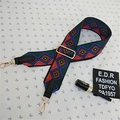 Detail view of ethnic geometric pattern wide strap with gold metal hooks and black leather ends - Style 3 Black