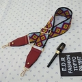 Close-up of colorful geometric strap with gold hooks and adjustable leather end - Style 2 Wine Red