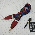 Close-up of geometric patterned colorful bag strap with gold metal hooks and red leather ends - Style 3 Wine Red