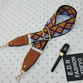 Detail of colorful geometric woven bag strap with golden lobster clasp and leather end - Style 2 Brown
