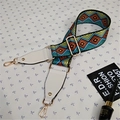 Detail of colorful geometric woven bag strap with white leather ends and gold hooks - Style 1 White