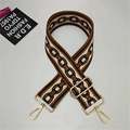 Detail of adjustable wide bag strap with geometric chain pattern and gold metal hooks - Style 4 Brown Ribbon